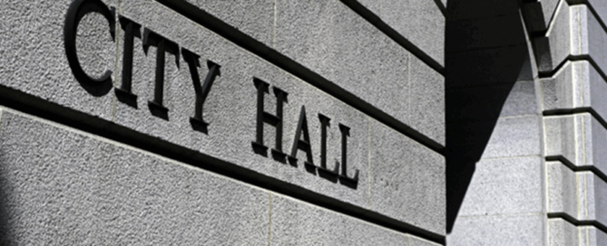 Exterior of a city hall building representing municipal security and public safety management.