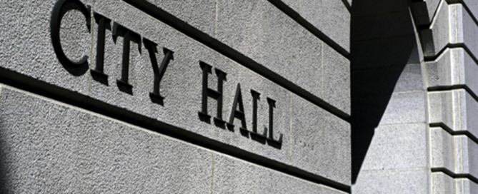 Exterior of a city hall building representing municipal security and public safety management.