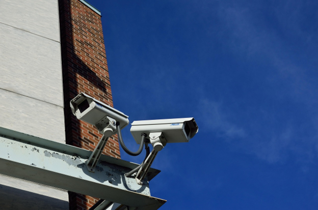 Close-up of a modern security camera used for municipal video surveillance and monitoring.