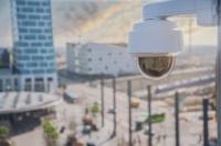 Image of a modern CCTV camera overlooking townsquare