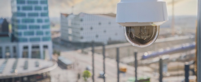 Image of a modern CCTV camera overlooking townsquare